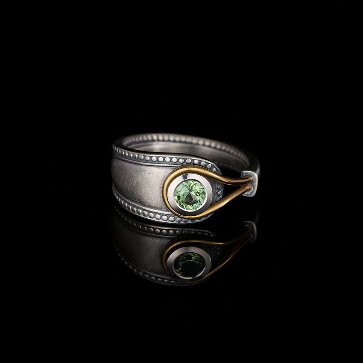green tourmaline ring in silver and gold