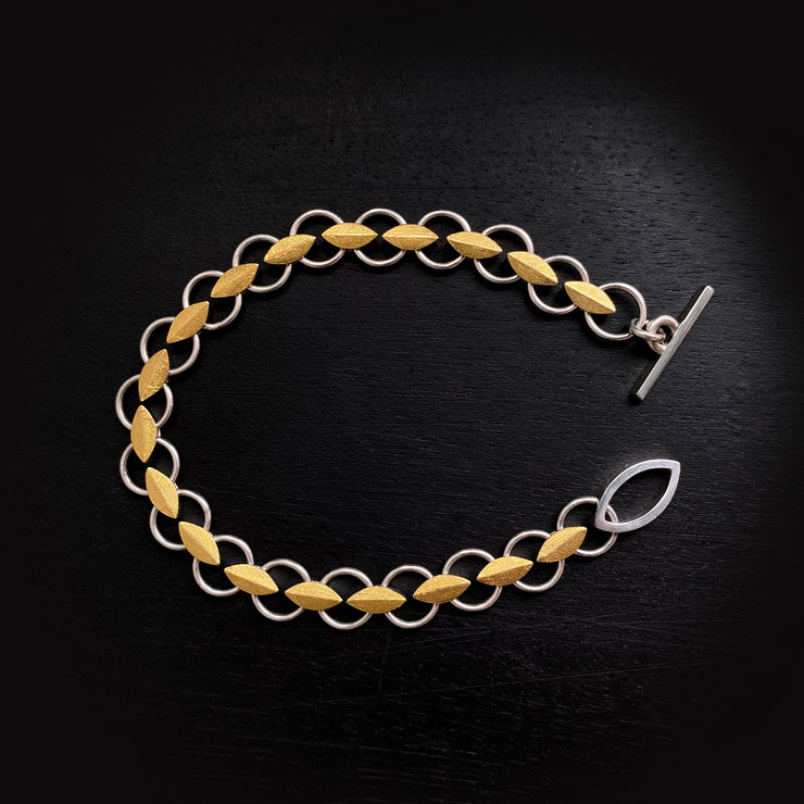 Leaf bracelet in silver and gold.