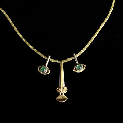 Triptych Face, yellow diamond necklace,