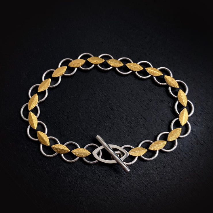 Leaf bracelet in silver and gold.