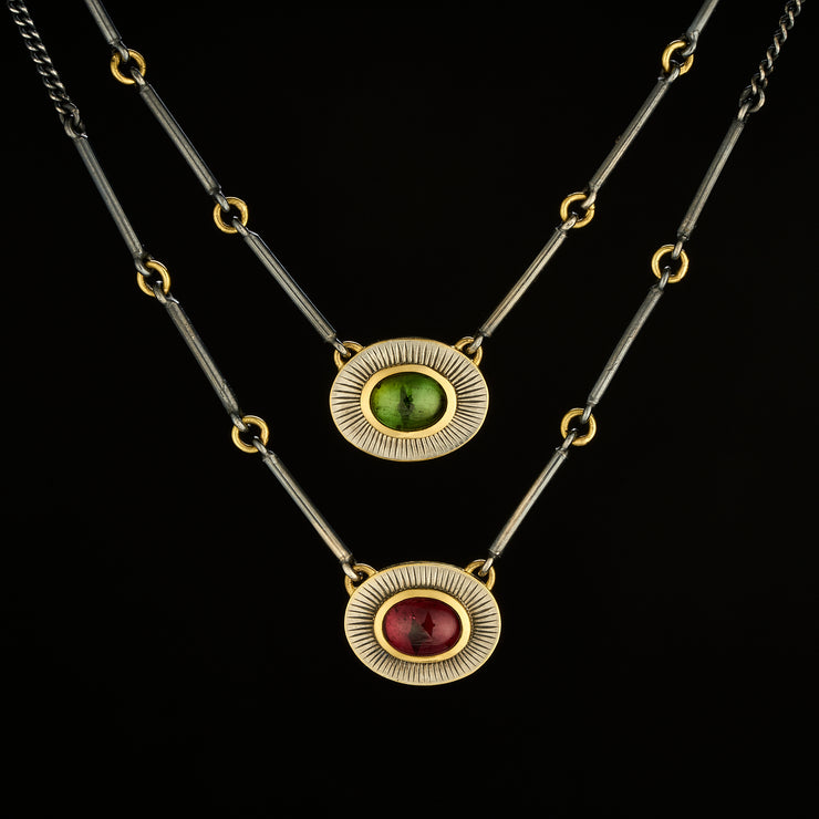 Halo necklace with garnet